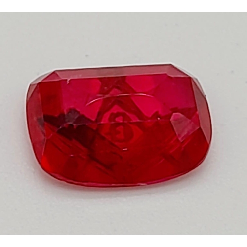 770 - A 3.5ct Faceted Ruby with a Gold Tooled Masonic Emblem.