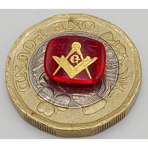 770 - A 3.5ct Faceted Ruby with a Gold Tooled Masonic Emblem.