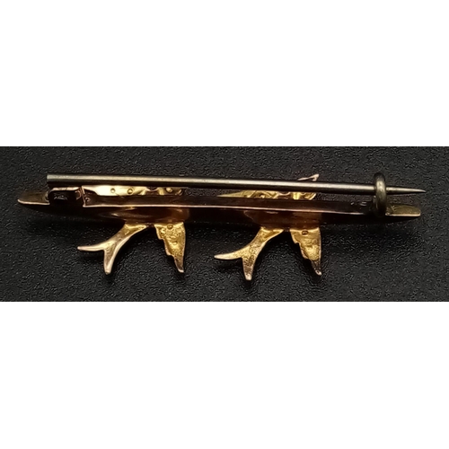 257 - A Victorian Mid-Karat Gold Swallow and Pearl Bar Brooch. Pin has been replaced. 4cm. 1.4g total weig... 