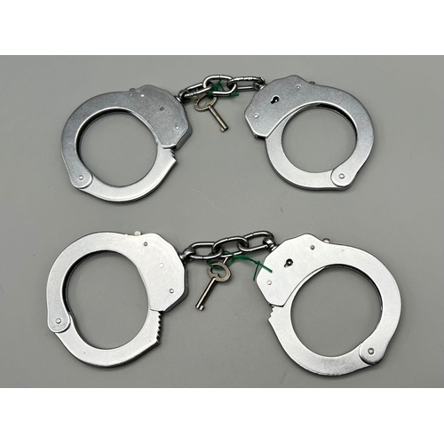 464 - Two Pairs of Police Metal Handcuffs with Keys.