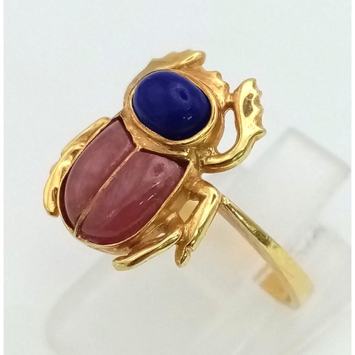 664 - 18k yellow gold lapis lazuli and coral set scarab ring, size K 1/2, 4.8g