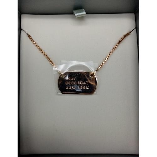 530 - A Christian Dior Gilded Tag Necklace. 42cm adjustable. Excellent condition. Comes in a Dior box. Ref... 