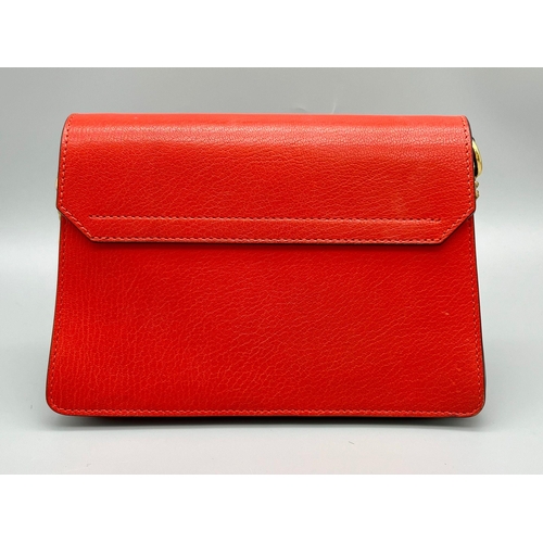 347 - A Givenchy GV3 Red Leather and Suede Shoulder Bag. Gilded hardware and shoulder chain. Multi-compart... 