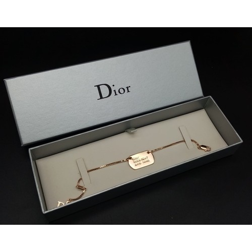 733 - A Christian Dior Gilded Tag Bracelet. Excellent condition. Comes in a Dior box. Ref: 11949