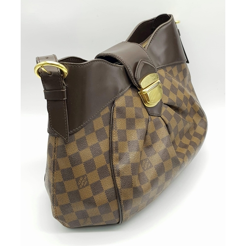 A Louis Vuitton Damier Ebene Sistina PM Bag. Brown checked canvas