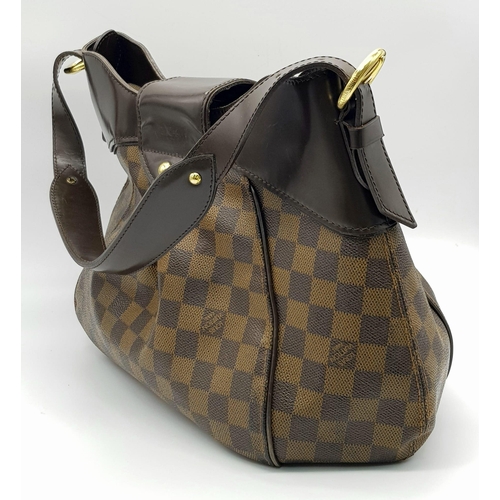A Louis Vuitton Damier Ebene Sistina PM Bag. Brown checked canvas with  brown leather and gilded hard