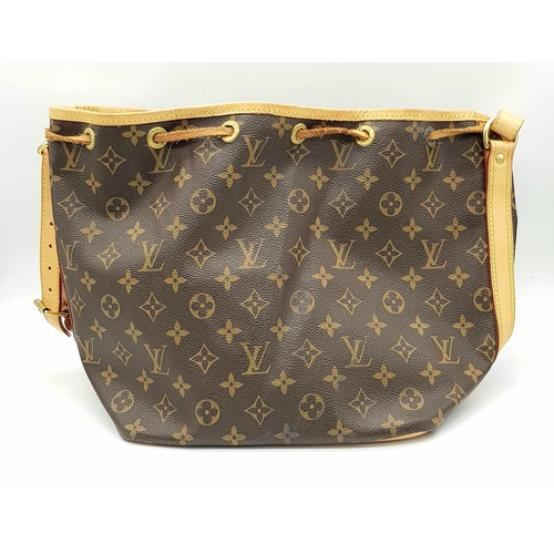 354 - A Lois Vuitton Bucket Bag. Monogram brown canvas with leather trim. 40cm width. 25cm height. Ref: 11... 