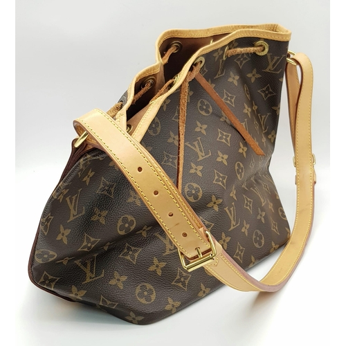 354 - A Lois Vuitton Bucket Bag. Monogram brown canvas with leather trim. 40cm width. 25cm height. Ref: 11... 