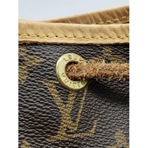 354 - A Lois Vuitton Bucket Bag. Monogram brown canvas with leather trim. 40cm width. 25cm height. Ref: 11... 