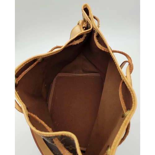 354 - A Lois Vuitton Bucket Bag. Monogram brown canvas with leather trim. 40cm width. 25cm height. Ref: 11... 