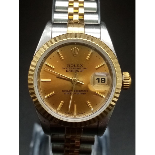 162 - A Rolex Oyster Perpetual Datejust Ladies Watch. Bi-metal strap and case - 26mm. Gold tone dial with ... 