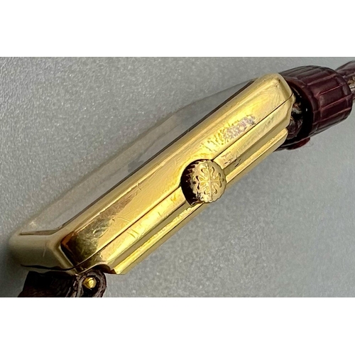 353 - A Classic Patek Philippe 18k Gold Ladies Watch. Burgundy leather strap. 18k gold case - 22 x 25mm. W... 