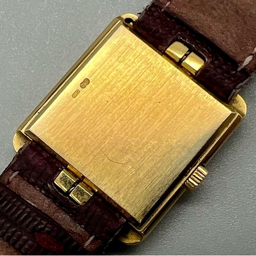 353 - A Classic Patek Philippe 18k Gold Ladies Watch. Burgundy leather strap. 18k gold case - 22 x 25mm. W... 