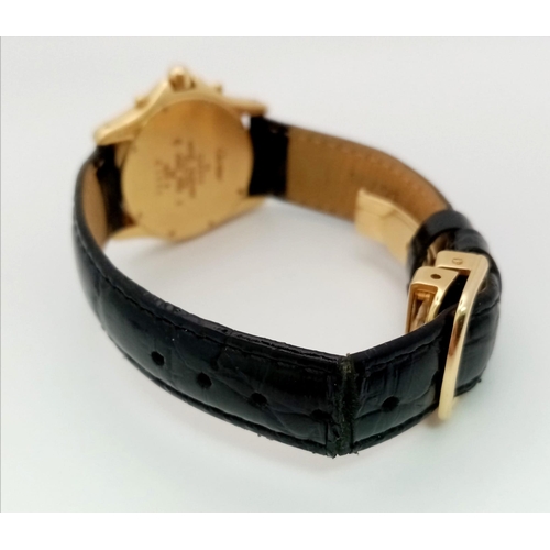 92 - A Cartier 18K Gold Quartz Chronograph Ladies Watch. Black leather strap with Cartier 18k gold buckle... 