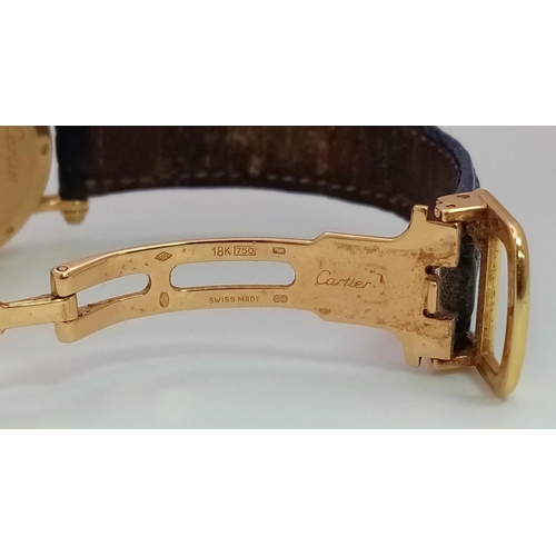 64 - A Cartier 18K Gold and Diamond Ladies Watch. Leather strap with gold Cartier clasp. 18k gold case - ... 