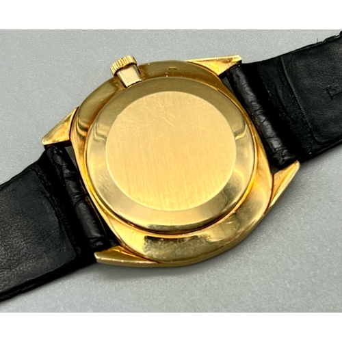 85 - A Vintage Patek Philiippe 18K Gold Watch. Black leather strap - 18k gold buckle. 18k gold case - 32m... 