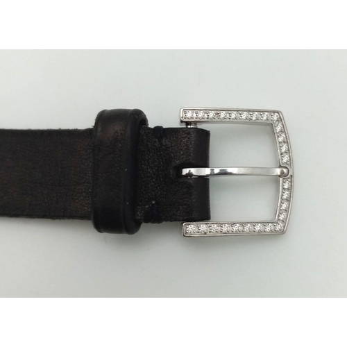 408 - A Tiffany and Co 18K Gold and Diamond Ladies Watch. Black leather strap with Tiffany white gold and ... 