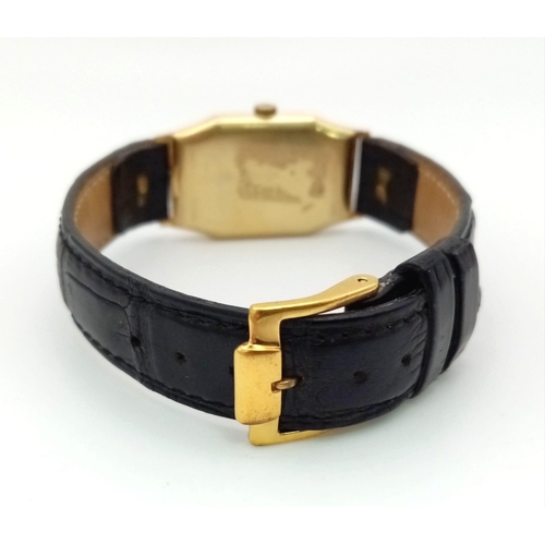 401 - A Vintage Omega Gold Ladies Watch. Black leather strap. Gold rectangular case - 22 x 32mm. Gold tone... 