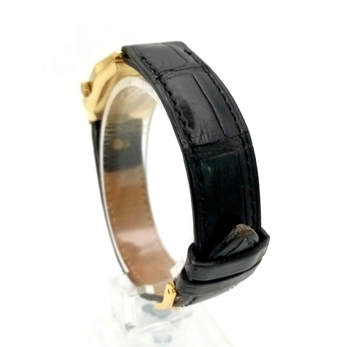 401 - A Vintage Omega Gold Ladies Watch. Black leather strap. Gold rectangular case - 22 x 32mm. Gold tone... 