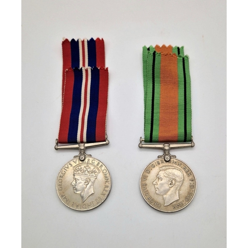 397 - A Parcel of 2 British WW2 Medals Comprising; 1) 1939/45 Medal with Ribbon and 2) The Defence Medal w... 