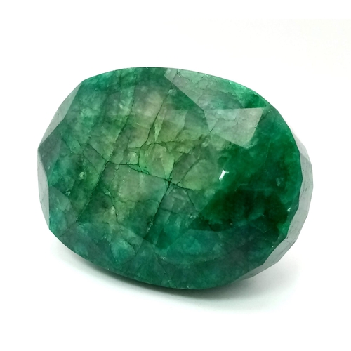 415 - A 1524ct Massive Brazilian Oval-Shaped Emerald. 8 x 5.5 x 4cm. Comes in a hexagonal presentation box... 