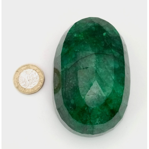 415 - A 1524ct Massive Brazilian Oval-Shaped Emerald. 8 x 5.5 x 4cm. Comes in a hexagonal presentation box... 