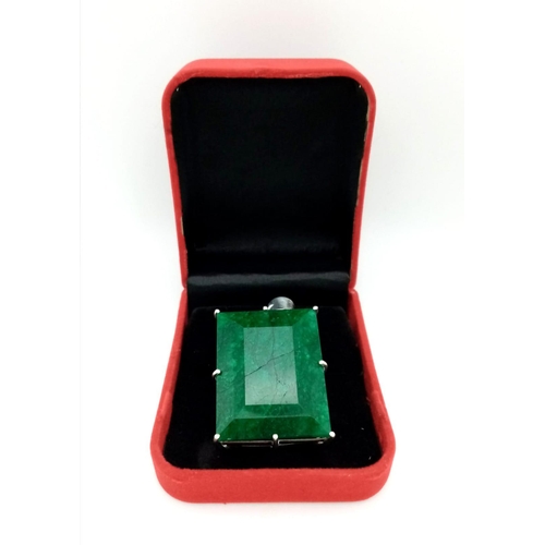 446 - A Huge Emerald Pendant. Rectangular step cut set in 925 Sterling silver. Emerald - 211.30 Ct. 4 x 3.... 