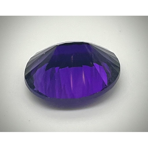 487 - A Gorgeous 28ct Purple Oval-Cut Faceted Gemstone (possibly amethyst). No visible inclusion. No certi... 