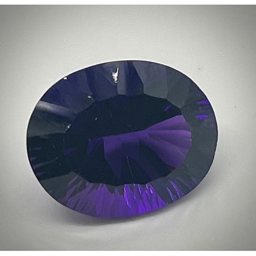 487 - A Gorgeous 28ct Purple Oval-Cut Faceted Gemstone (possibly amethyst). No visible inclusion. No certi... 