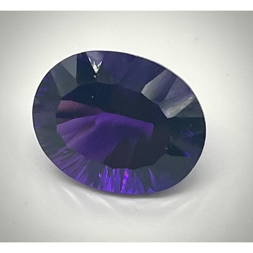 487 - A Gorgeous 28ct Purple Oval-Cut Faceted Gemstone (possibly amethyst). No visible inclusion. No certi... 