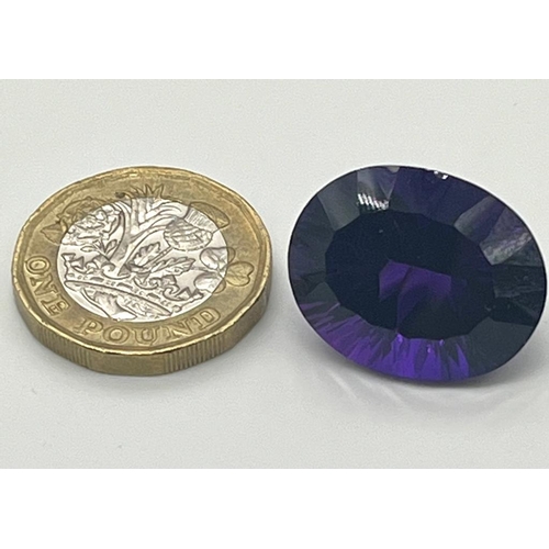 487 - A Gorgeous 28ct Purple Oval-Cut Faceted Gemstone (possibly amethyst). No visible inclusion. No certi... 