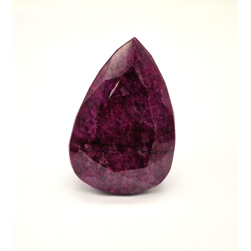 501 - An Immense 2216ct Faceted Pear-Shaped Natural African Ruby Gemstone. Comes with a GLI certificate in... 