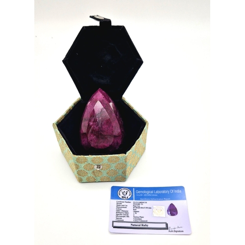 501 - An Immense 2216ct Faceted Pear-Shaped Natural African Ruby Gemstone. Comes with a GLI certificate in... 