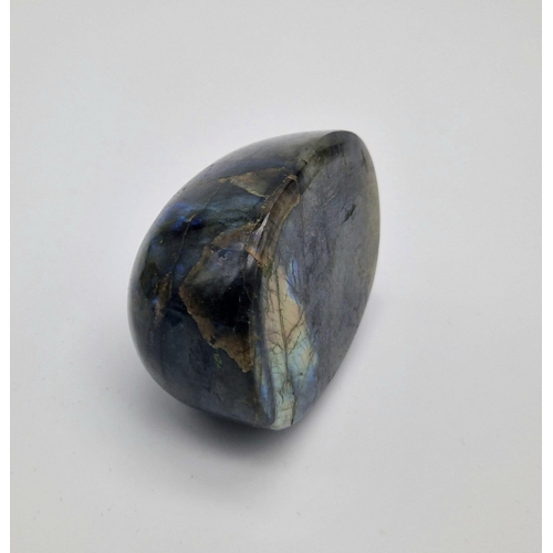 690 - A Huge 1830ct Labradorite Oval Cabochon. Dark green with colour-play. Comes with a GLI certificate a... 