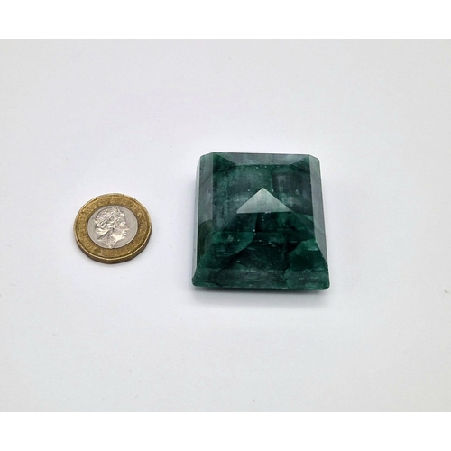 718 - A 385ct Large Faceted Brazilian Square-Step Emerald. 4 x 4cm.