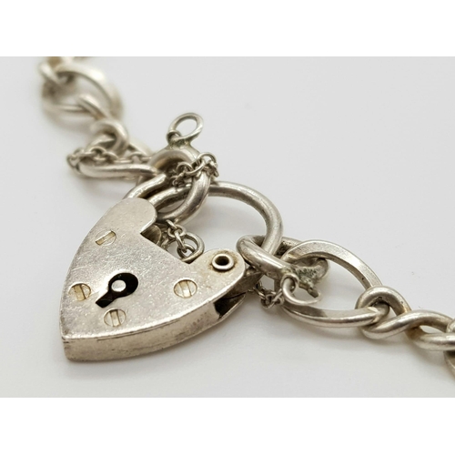 694 - STERLING SILVER CHARM BRACELET NO CHARMS BUT WITH PADLOCK READY TO CREATE YOUR OWN MEMORIES 8.2G