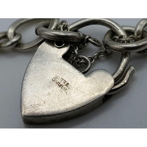 694 - STERLING SILVER CHARM BRACELET NO CHARMS BUT WITH PADLOCK READY TO CREATE YOUR OWN MEMORIES 8.2G