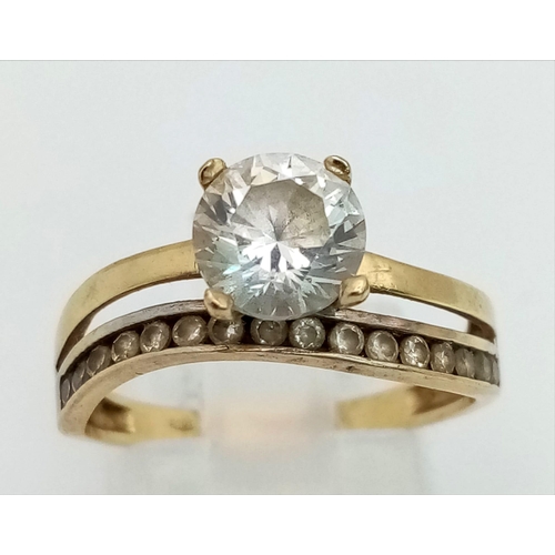 745 - 14k yellow gold CZ solitaire double band ring with CZ set shoulders. Total Weight 2.8g, size N