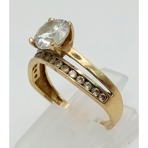 745 - 14k yellow gold CZ solitaire double band ring with CZ set shoulders. Total Weight 2.8g, size N