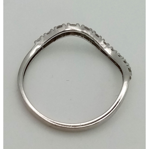 759 - 18k white gold wave shaped half eternity ring set with 11 CZ stones, Total Weight 1.2g, size M