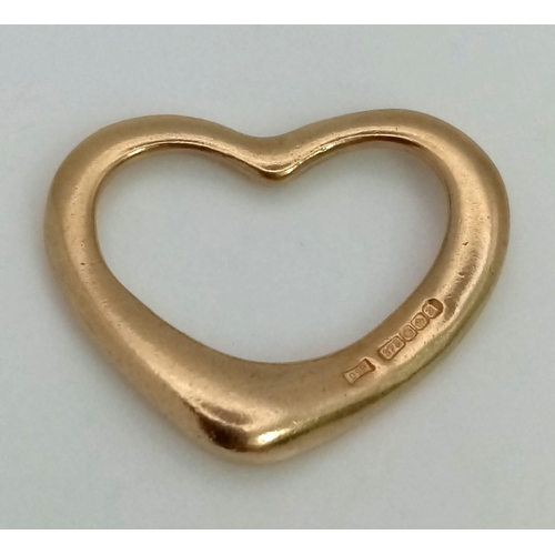 807 - 9k yellow gold Tiffany style open heart pendant. Weighs 2.2g