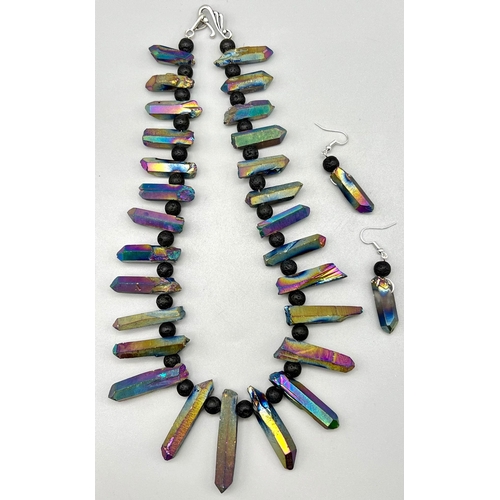 782 - A very unusual necklace and earrings set consisting of large natural quartz crystals covered with Ti... 