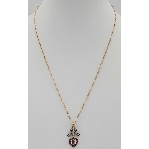 329 - A 9K Gold Ruby and Pearl Heart Pendant on a 9K Gold Necklace. 3 and 42cm. 2.72g total weight.