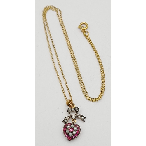 329 - A 9K Gold Ruby and Pearl Heart Pendant on a 9K Gold Necklace. 3 and 42cm. 2.72g total weight.