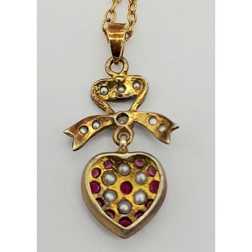 329 - A 9K Gold Ruby and Pearl Heart Pendant on a 9K Gold Necklace. 3 and 42cm. 2.72g total weight.