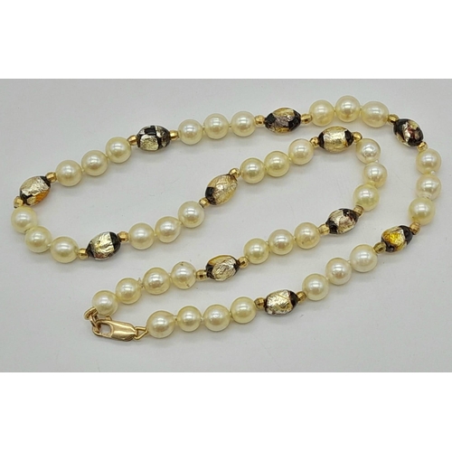 535 - A Cultured Pearl and Murano Glass Necklace. 9K gold clasp. 
40cm.