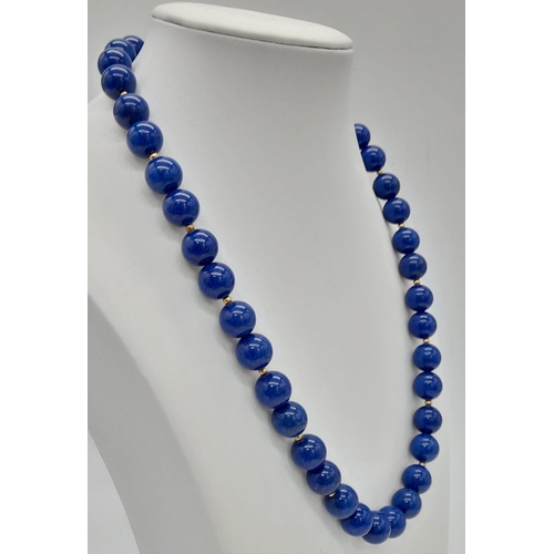 641 - A Lapis Lazuli Bead Necklace with Gilded Silver Clasp. 44cm.
12mm beads