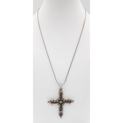 669 - A Vintage Amethyst, Peridot, Garnet Cross Pendant on a 925 Silver Chain. Cross - 5 x 6cm. 20.5g tota... 