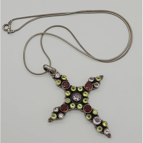 669 - A Vintage Amethyst, Peridot, Garnet Cross Pendant on a 925 Silver Chain. Cross - 5 x 6cm. 20.5g tota... 