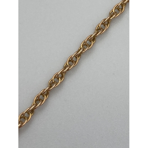 104 - 9 carat GOLD CHAIN NECKLACE with gold safety chain attached. 4.52 grams. 56 cm.